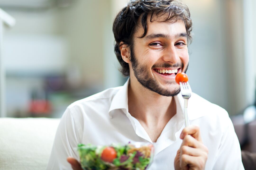 man eats vegetables to empower