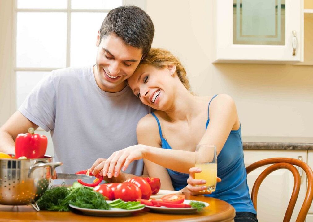 woman and man preparing vegetables to increase potency