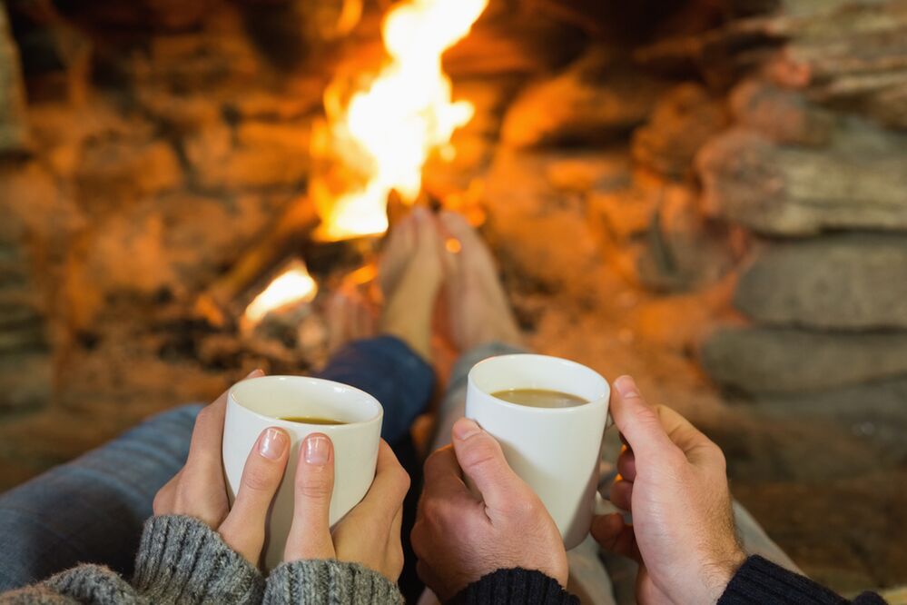 The couple in front of the bonfire